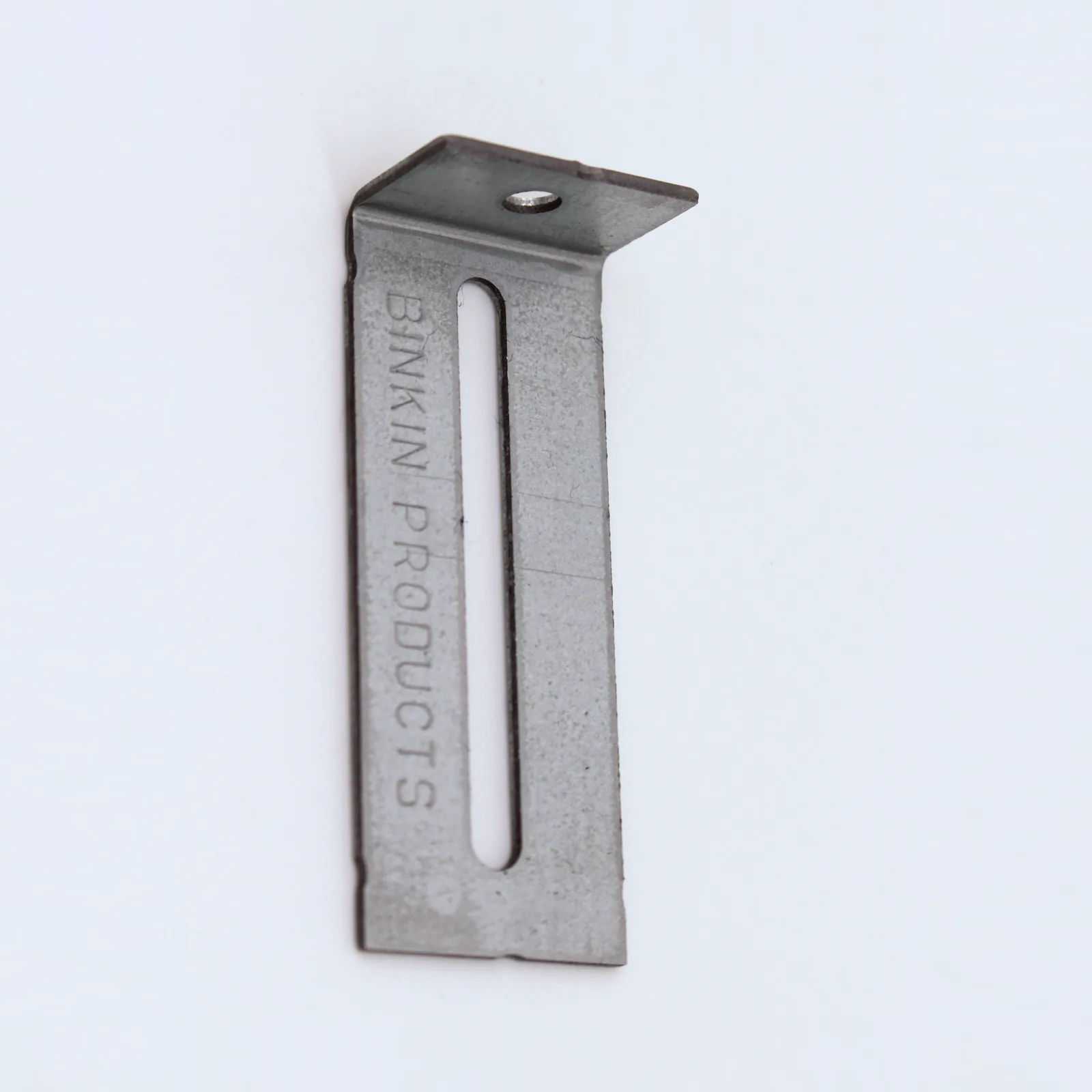 A BINKIN slotted L-bracket seen from above: the slot in the long leg and the anchor hole in the short leg